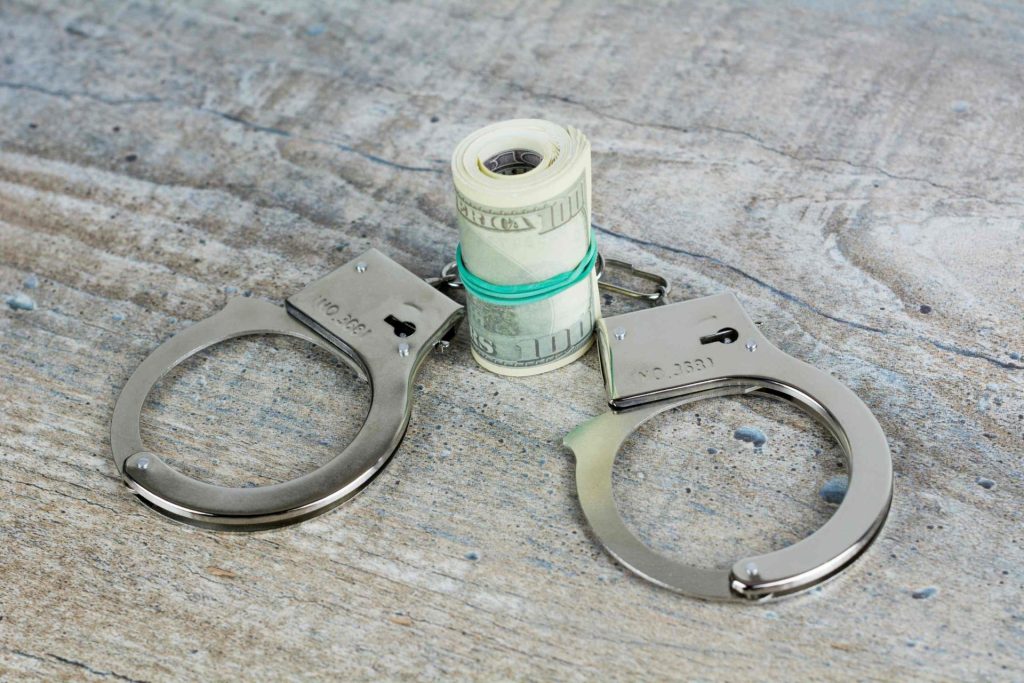 Handcuffs and rolled money